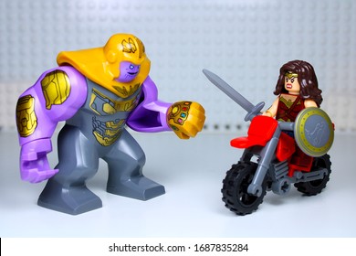 DETROIT, USA - MAR 30, 2020: Lego Wonder Woman Attacks Thanos On Her Bike.