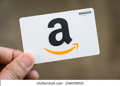 Detroit, USA - Sep 29, 2019 : Hand holding an Amazon white color gift card isolated