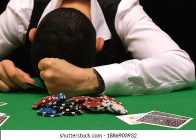 Devastated Gambler Man Losing A Lot Of Money Playing Poker In Casino, Gambling Addiction. Divorce, Loss, Ruin, Debt, Ludopata Concept.