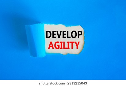 Develop agility symbol. Concept words Develop agility on beautiful white paper on a beautiful blue background. Business, support and develop agility concept. Copy space. - Shutterstock ID 2313215043