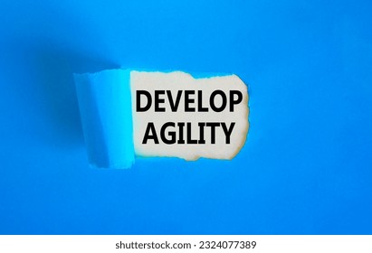 Develop agility symbol. Concept words Develop agility on beautiful white paper on a beautiful blue background. Business, support and develop agility concept. Copy space. - Shutterstock ID 2324077389