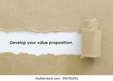 "Develop your value proposition" slogan written under torn paper.