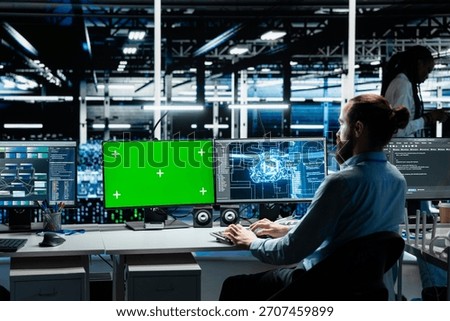 Developer in data center using isolated screen PC, optimizing gear for AI tasks, increasing workloads. Server room IT worker automating system diagnostics using deep learning on chroma key computer