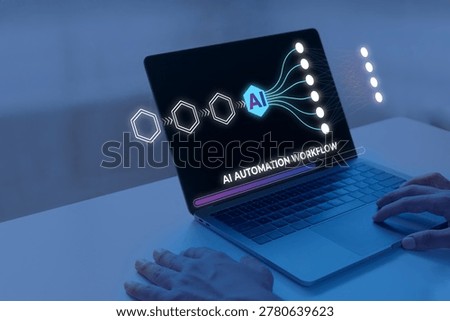 Developer hands on a laptop displaying an augmented reality holographic AI automation workflow interface with neural network machine learning graphics. Futuristic technology concept with moody blue cinematic lighting.