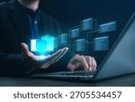 A developer holding a glowing hologram of an SQL database schema with relational tables and links, illustrating data modeling, system architecture, and modern database management for IT solutions.