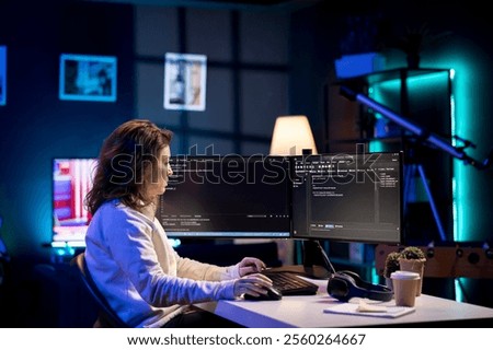 Developer in neon lit apartment implement security measures, protecting company systems and data. System administrator working from home, testing and debugging Javascript code