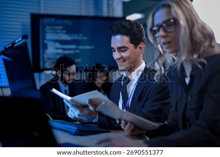 A developer points enthusiastically to the screen, showing his colleague the elegant and efficient code generated by their generative AI coding partner, celebrating a new level of productivity.