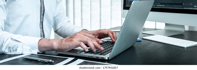 Developer programmer working on coding program software computer in office, Writing website and development database technology.