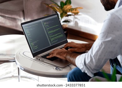 Developer programmer writing html javascript code in a laptop. - Powered by Shutterstock