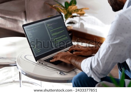 Developer programmer writing html javascript code in a laptop.