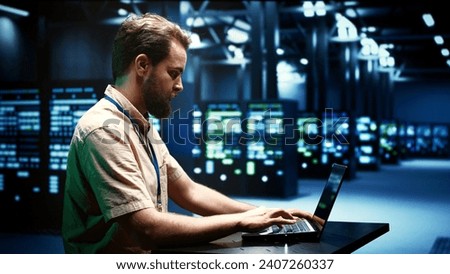 Developer running server rigs diagnostic tests and error checking utilities to identify and resolve software problems. Programmer closely monitoring critical systems, checking for any potential issues