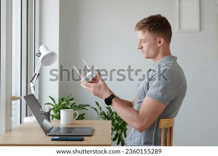 Developer setting new router in his home office