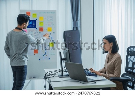 Developer team present project interface design with board and solving problem at office