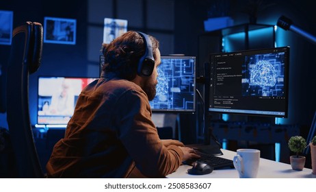 Developer updating artificial intelligence neural networks, drinking coffee and listening music in personal office. IT expert enjoying hot beverage and audio podcasts while writing AI code, camera B