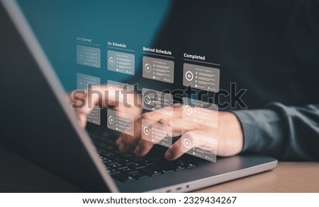 The developer uses computer laptop to use planning software, project management for tasks or responsible methodology boards on screen. Process, workflow, task list, due date setting application tool.