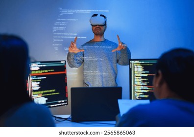 developer uses a VR headset to interact with projected interface designs, while colleagues discuss and code on screens, highlighting the integration of virtual reality and UIUX design