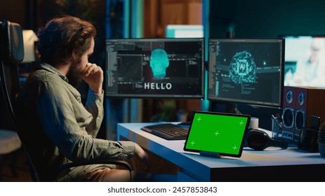 Developer using green screen tablet updating artificial intelligence machine learning algorithm, writing binary code scripts. IT expert programming on mockup device to upgrade AI brain, camera A - Powered by Shutterstock