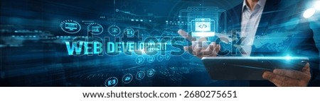 Developer using tablet analyzing web development framework data coding, UX automation integration design optimization testing performance deployment.