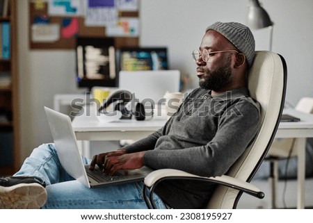 Developer working with software on laptop