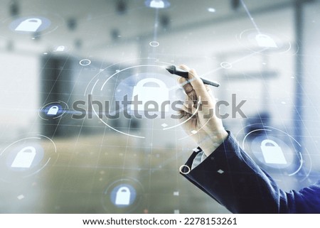 Developer's hand with pen working with virtual creative lock illustration with microcircuit on blurred office background, cyber security concept. Multiexposure