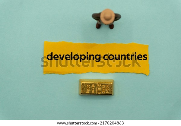 developing countries.The\
word is written on a slip of paper,on colored background.\
professional terms of finance, business words, economic phrases.\
concept of economy.