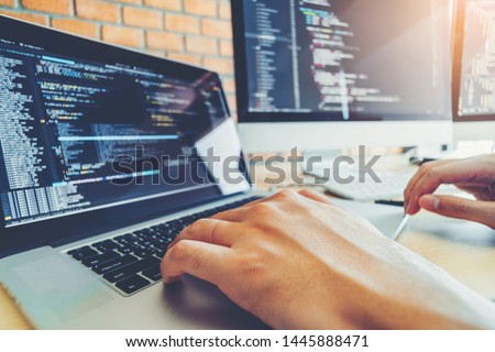 Developing programmer Team Development Website design and coding technologies working in software company office