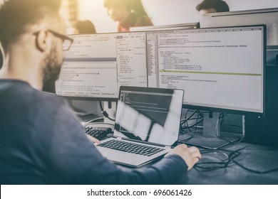 Developing programming and coding technologies. Website design. Programmer working in a software develop company office. - Shutterstock ID 696061426