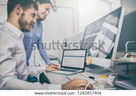 Developing programming and coding technologies. Website design. Programmer working in a software develop company office.