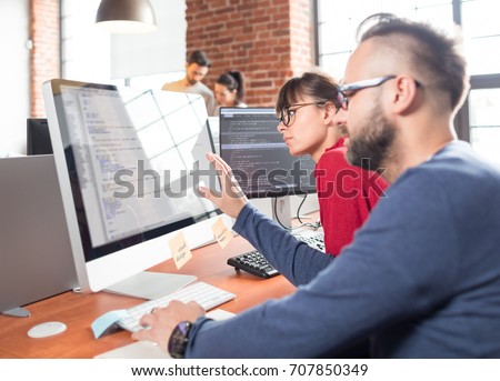 Developing programming and coding technologies. Website design. Programmer working in a software develop company office.