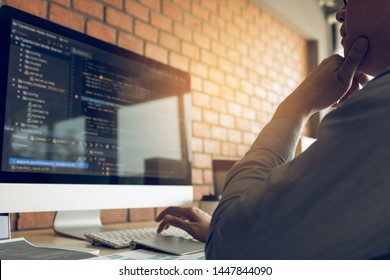 Developing programming and coding technology working in a software develop company office.
