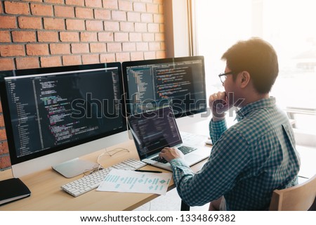 Developing programming and coding technology working in a software develop company office.