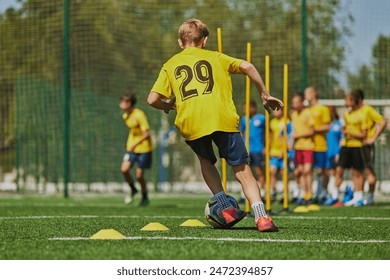 Developing Soccer Skills. Football players, boys in uniforms practicing on outdoor stadium on sunny day. Coordination and skills. Concept of sport, school, childhood, hobby, active lifestyle - Powered by Shutterstock