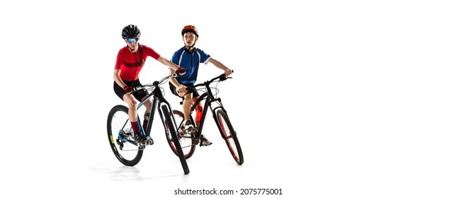 Developing speed. Collage of woman and boy, cyclists, riding a bike in helmet isolated over white background. Concept of sport, strength, action, motion, vitality, health. Copy space for ad