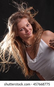 developing in the wind the hair on black background