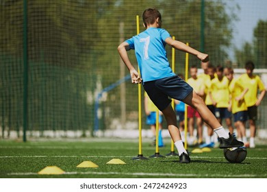 Developing Young Athletes. Young boys in soccer practice session, training, developing coordination and team dynamics. Outdoor arena. Concept of sport, school, childhood, hobby, active lifestyle - Powered by Shutterstock