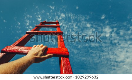 Development Attainment Motivation Career Growth Concept. Mans Hand Reaching For Red Ladder Leading To A Blue Sky