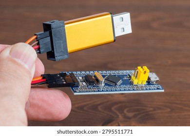 Development board STM and programmer in hand