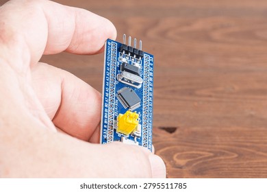 Development board STM and programmer in hand
