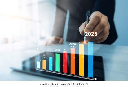 Development corporate to business success and achievement in 2025 year.Business plan in company 2025.Businessman touching growth chart from success year 2025. - Powered by Shutterstock