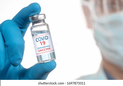 Development and creation of a coronavirus vaccine COVID-19 .Coronavirus Vaccine in glass bottle in hand of doctor blue vaccine jar on white background. Vaccine Concept of fight against coronavirus - Shutterstock ID 1697873311