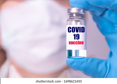 Development and creation of a coronavirus vaccine COVID-19 .Coronavirus Vaccine concept in hand of doctor blue vaccine jar. Vaccine Concept of fight against coronavirus. - Shutterstock ID 1698621433