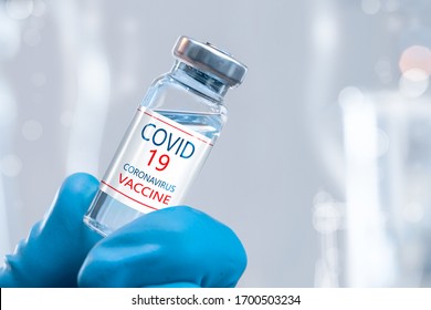 Development and creation of a coronavirus vaccine COVID-19 .Coronavirus Vaccine concept in hand of doctor blue vaccine jar. Vaccine Concept of fight against coronavirus. - Shutterstock ID 1700503234