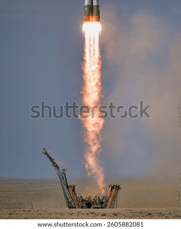 The development and deployment of nuclear weapons throughout history. Urban industrial pollution clouds formed by smoke. A rocket launching in the air. Elements of this image furnished by NASA