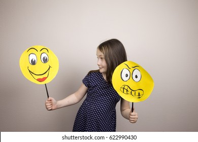 Development Of Emotional Intelligence. The Girl Plays With Smiles, Builds Erysipelas. Laughter, Fun, Anger. Teaching A Child.