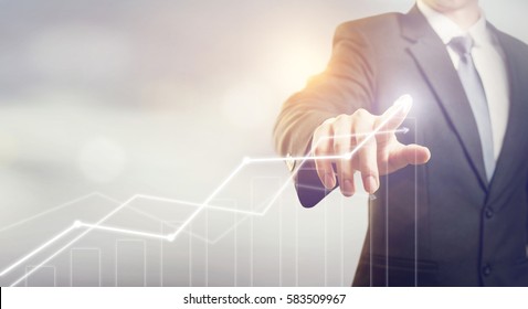 Development and growth concept. Businessman plan growth and increase of positive indicators in his business. - Shutterstock ID 583509967