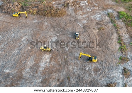 Development of real estate market in the USA. Aerial view of large construction site with building equipment on prepared soil in American rural area 商業照片 © 