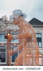 Deventer, Netherlands - December 15, 2018:  The Figure Scrooge From Christmas Carol By Charles Dickens Shaped In A Light Element During The Dickens Festival In Deventer