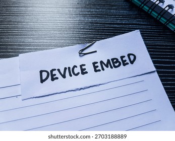 Device embed writting on table background.
