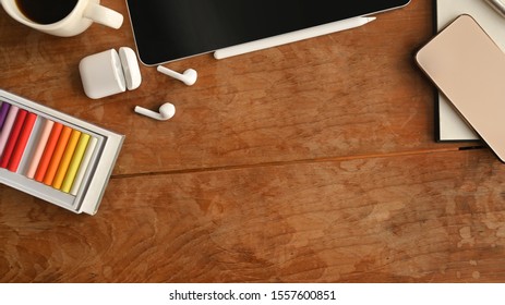 Device gadget on creative table with top view.