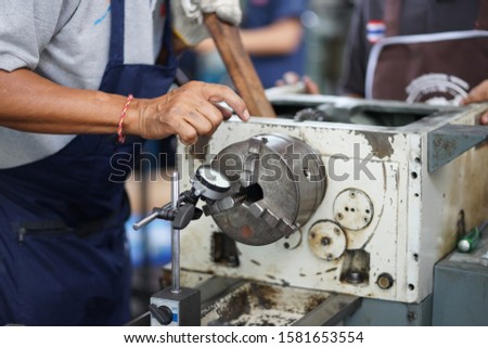 the device for measuring the end runout. Concept micrometer with measuring scale and indicator, lathe, profession Turner, equipment, beat check.